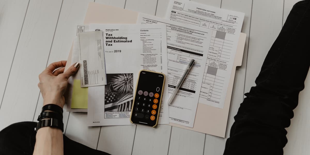 Calculator and budget documents on desk